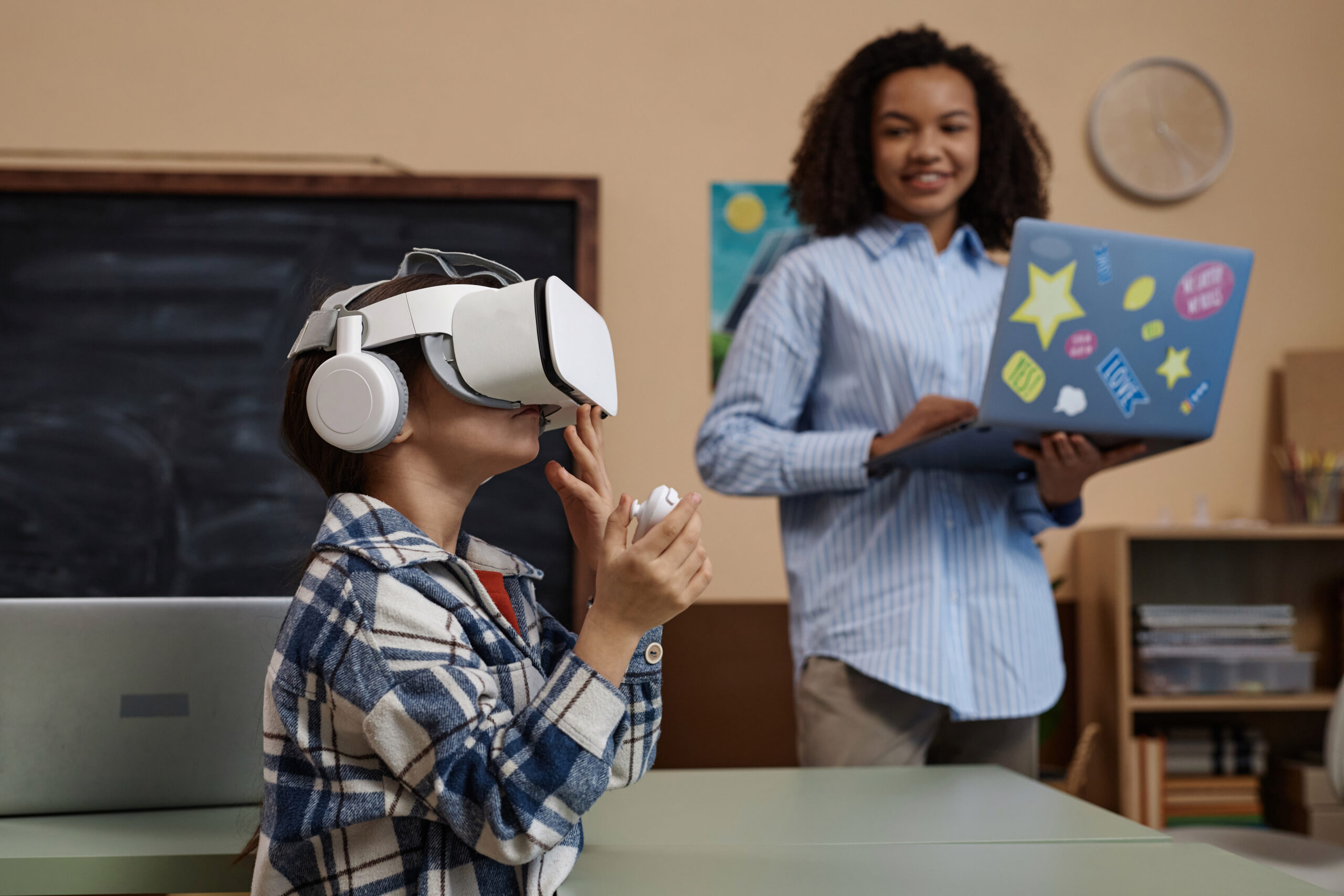 Side view portrait of little girl wearing VR headset in class and enjoying futuristic learning technology.